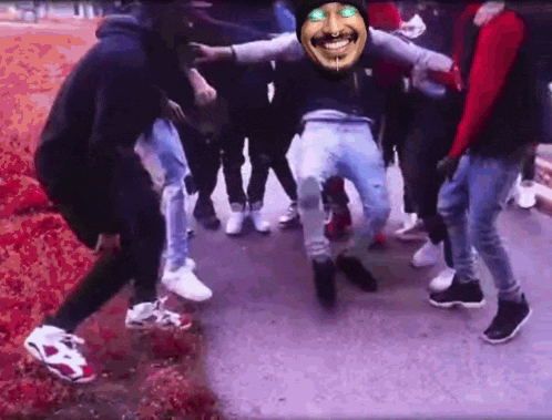 a group of people are dancing with a man with a mustache and green eyes