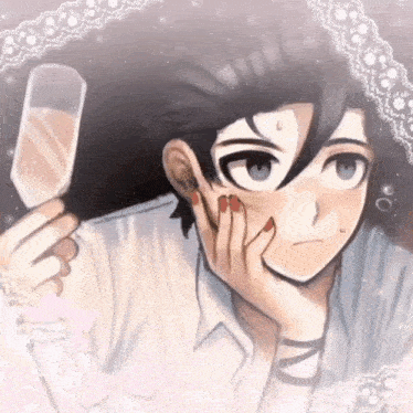 a boy is holding a glass of champagne in his hand .