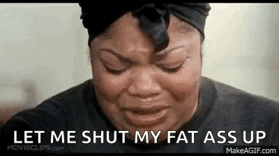 a woman is crying with the words `` let me shut my fat ass up '' written on her face .