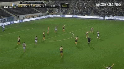 a soccer game is being played in a stadium sponsored by barclays premier league