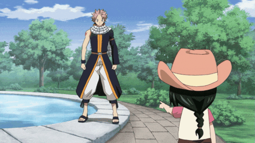 a girl in a cowboy hat is pointing at a man in a black coat