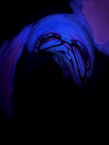 a blue and purple swirl in a dark room