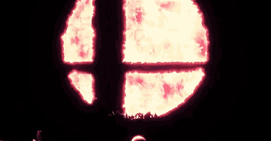 a person is standing in front of a fireball in the shape of a cross .