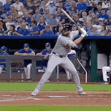 a baseball player with the number 17 on his jersey is swinging his bat