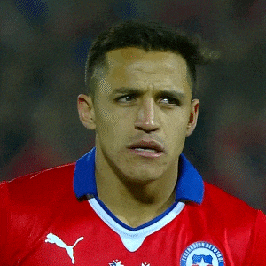a man wearing a red jersey with puma on the front