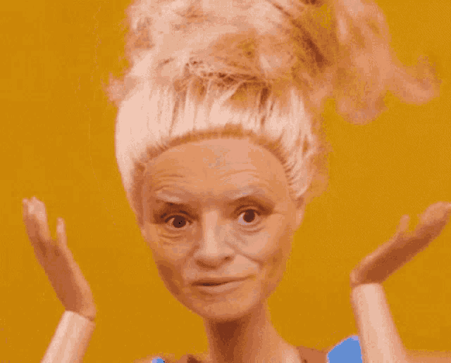 a barbie doll with a bun on her head looks like an older woman