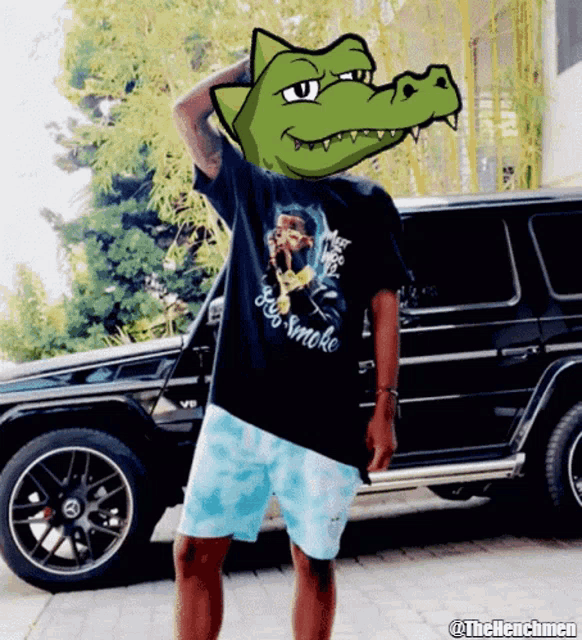 a man wearing a shirt that says see smoke stands in front of a black suv