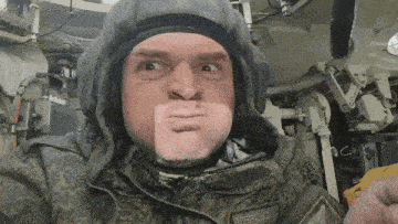 a man wearing a helmet and a jacket with a patch on his chest that says ' marprosoi '