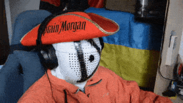 a person wearing a red captain morgan hat