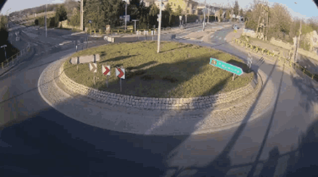 a roundabout with a sign in the middle that says ' zgorzelec '