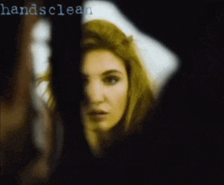 a blurred image of a woman 's face with the words handsclean above her