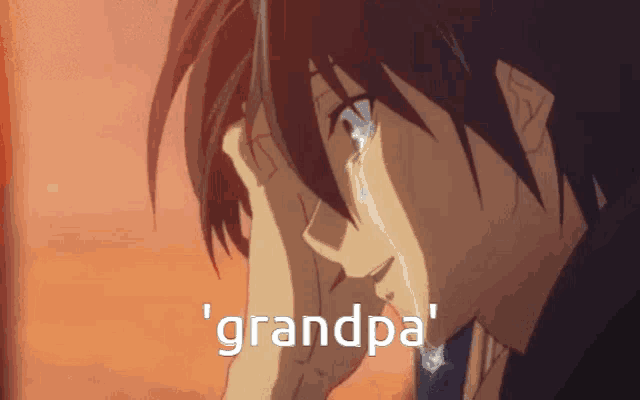 a man is crying and the word grandpa is on the screen