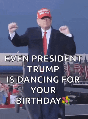 a man in a suit and tie is dancing for his birthday
