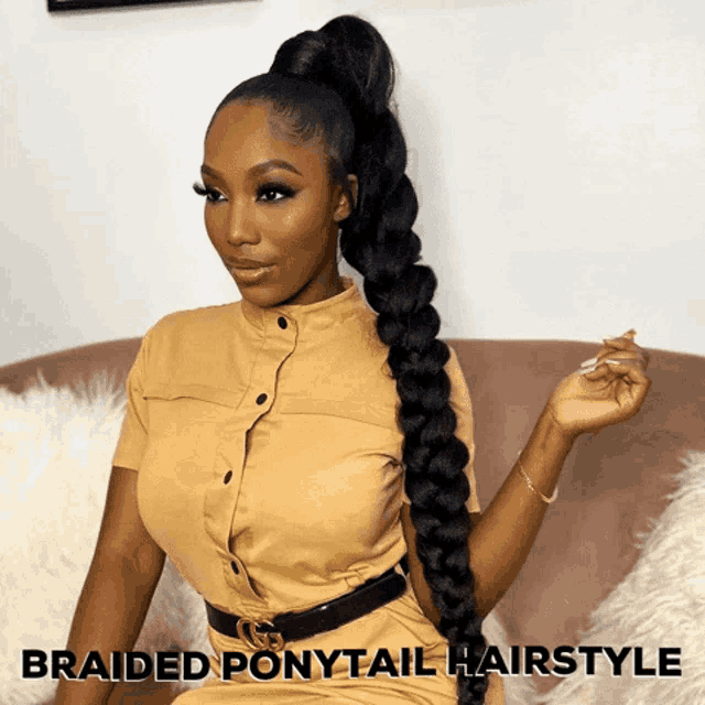 a woman wearing a braided ponytail hairstyle