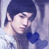 a close up of a young man holding a heart in his hand .