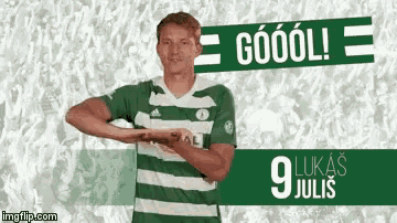 a man in a green and white striped shirt is standing in front of a sign that says goool