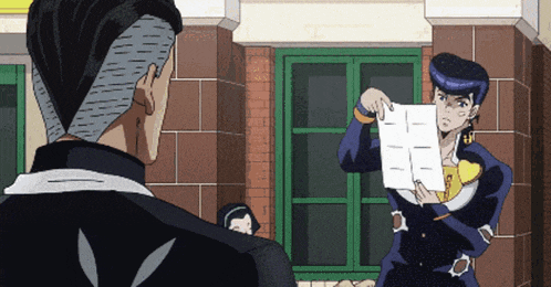 a man is holding a piece of paper that says i on it