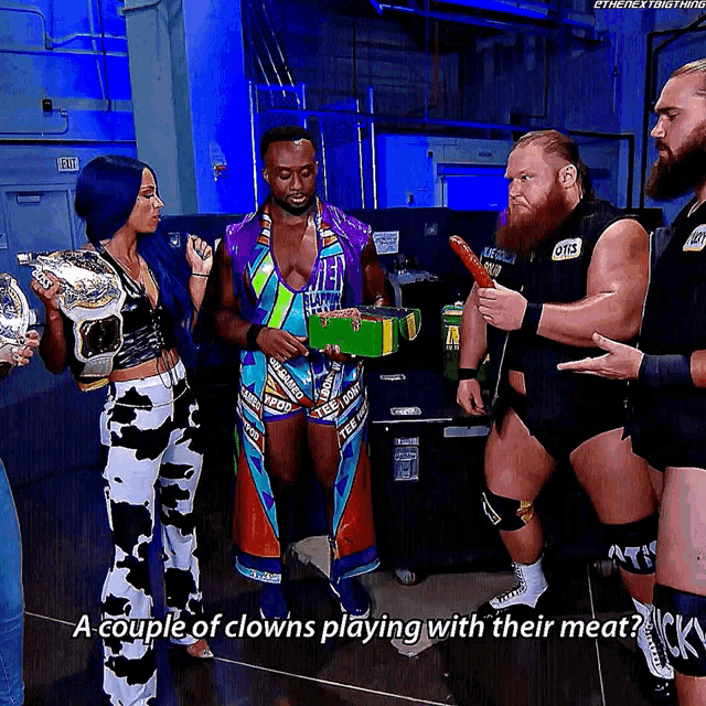 a couple of clowns playing with their meat in a wrestling match