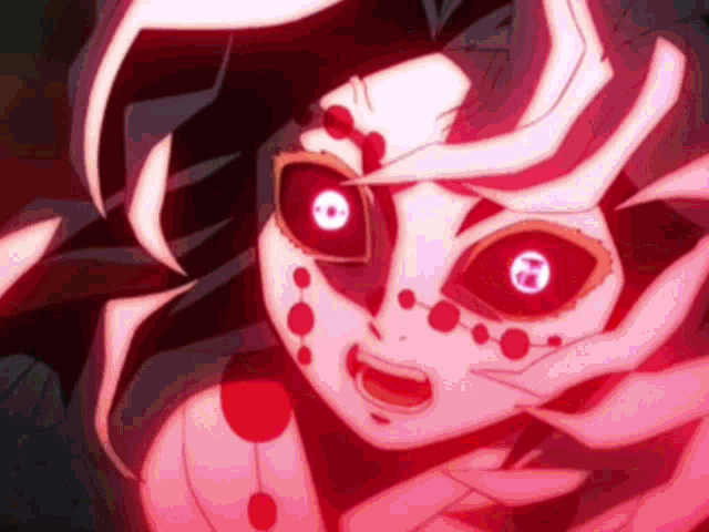 a close up of a person 's face with red eyes and spider webs .