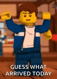 a lego man is standing in a room with his arms outstretched .