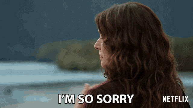 a woman says i 'm so sorry with a netflix logo behind her