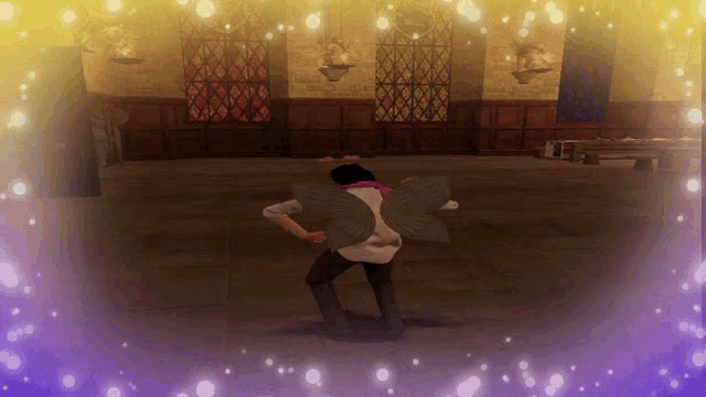 a person with wings on their back is dancing in a room
