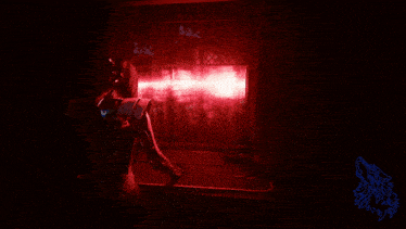 a person holding a gun in a dark room