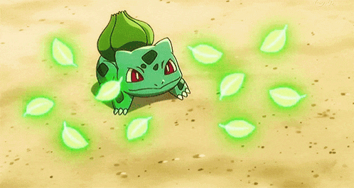 a green frog is standing next to a green leaf