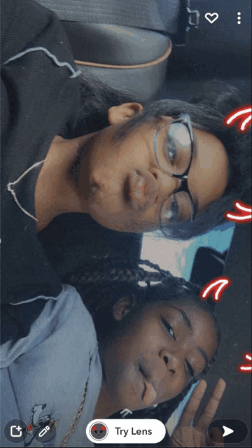 two girls are making funny faces with a try lens icon