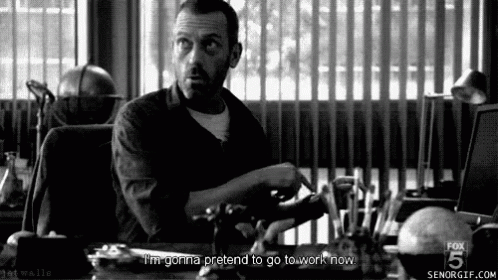 Hugh Laurie Pretend To Work GIF - Hugh Laurie Pretend To Work House Md GIFs