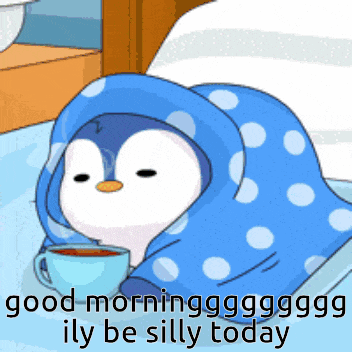 a penguin wrapped in a blue blanket with a cup of coffee
