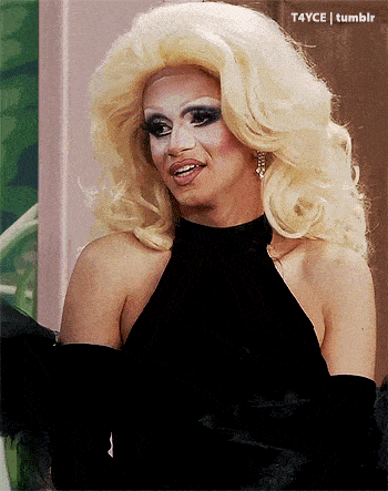 a drag queen with blonde hair and a black dress says t4yce tumblr on the bottom