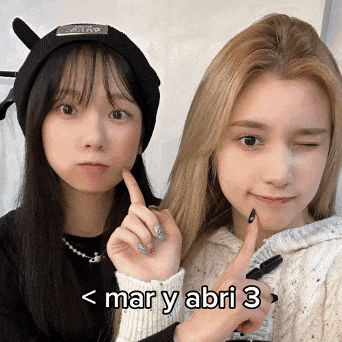 two girls are standing next to each other with the words mar y abri 3 on the bottom