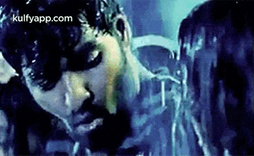 a man and a woman are kissing in a dark room in a movie .