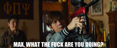 a boy is holding a gun and the words max what the fuck are you doing