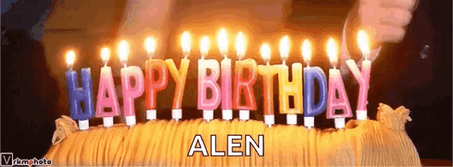 a birthday cake with candles that say happy birthday