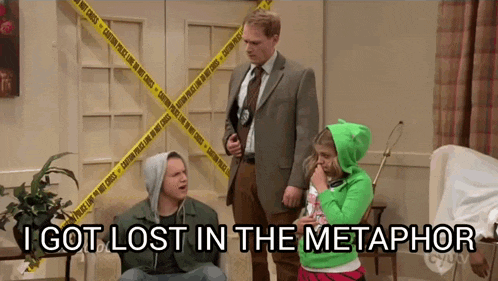 a man in a suit stands next to a girl in a green hoodie and says " i got lost in the metaphor