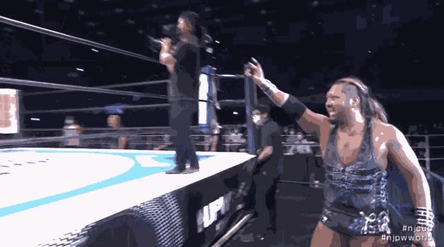 a man in a wrestling ring with the hashtag #njpworld on the bottom