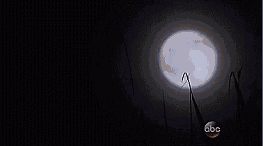 a large white light is shining in the dark with a abc logo in the corner .