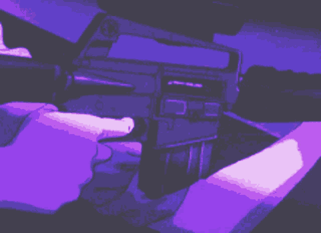 a pixel art of a person holding a gun in a purple light