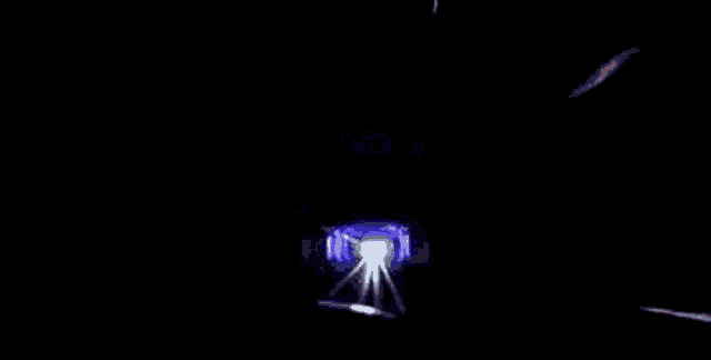 a train is going through a purple tunnel