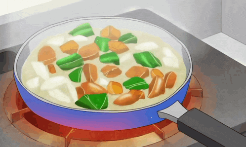 a pan of vegetables is cooking on a stove top