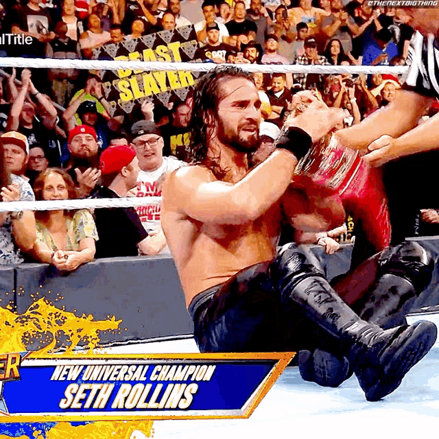 a man in a wrestling ring with the words new universal champion seth rollins