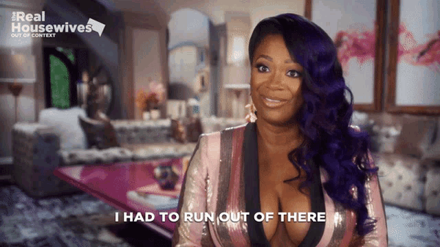 a woman with purple hair says " i had to run out of there " in front of a real housewives logo