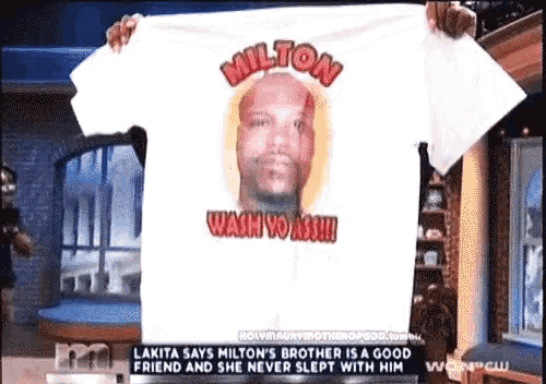 a person is holding up a shirt that says milton wash yo ass