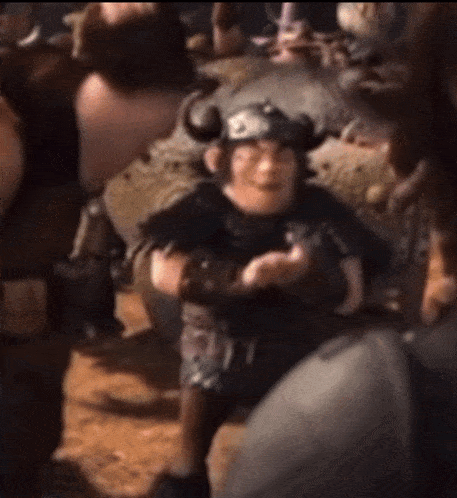 a cartoon character wearing a horned helmet is standing in a crowd of people