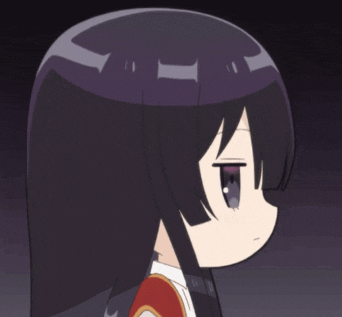 a close up of a girl 's face with a serious look on her face