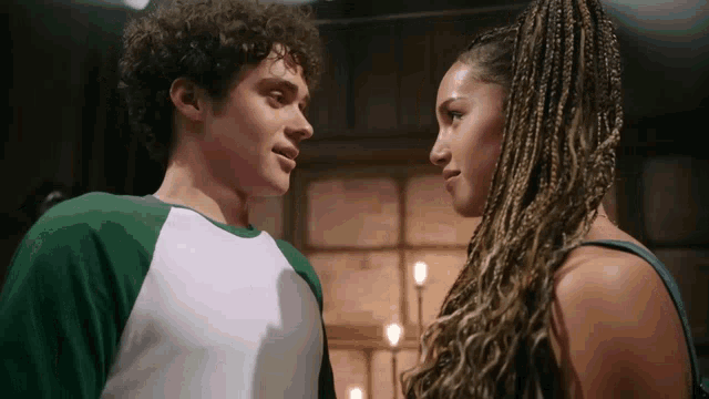 a man and a woman looking at each other