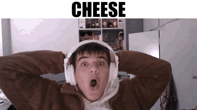 a man wearing headphones with the word cheese on the top