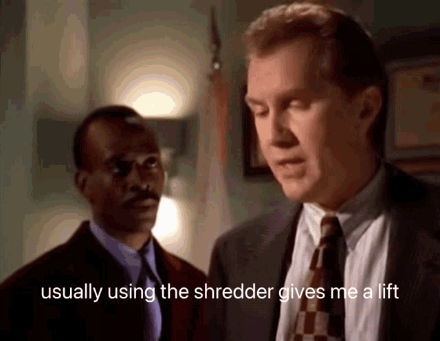 a man in a suit and tie says " usually using the shredder gives me a lift " in front of another man